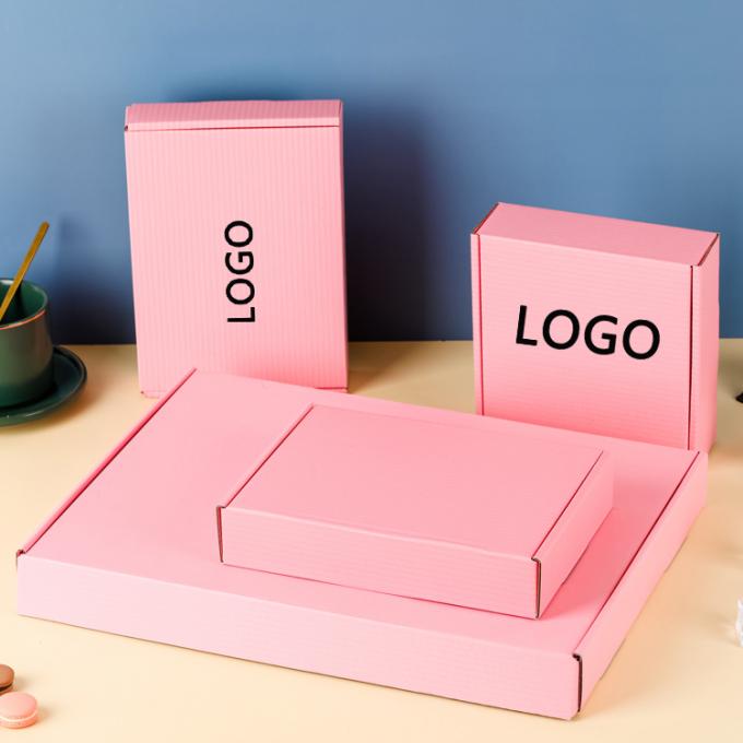 Indumenti a taglio a striscia personalizzati Mailer Cartoncino di carta imballaggio ondulato scatole di spedizione rosa 10